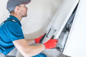 technician-inspecting-furnace