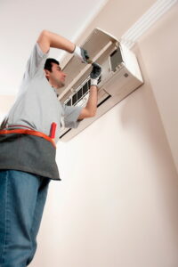 technician-repairing-the-air-handler-of-a-ductless-system