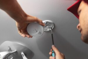 person-installing-a-carbon-monoxide-detector