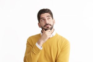 person-with-chin-in-hand-and-thoughtful-expression